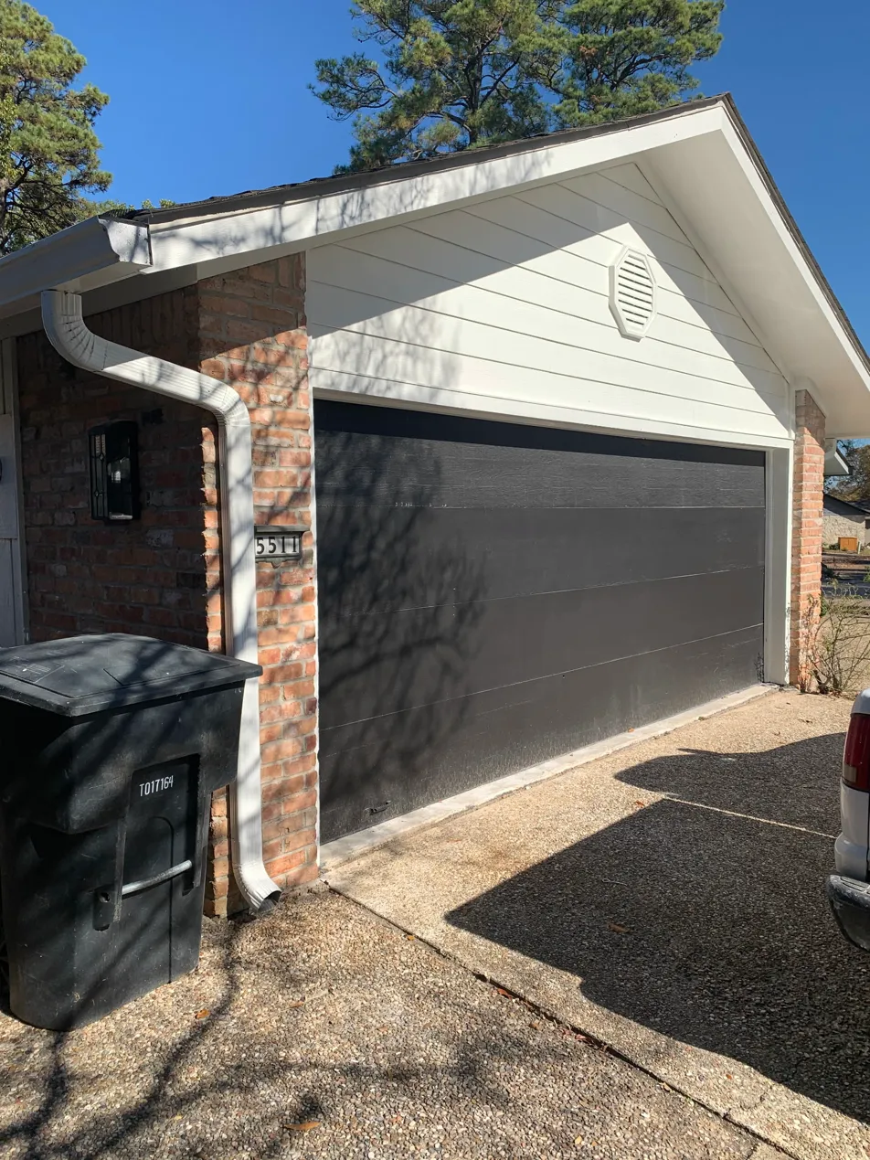 Exterior repaint — white siding and dark garage door, Cross Lake Shreveport
