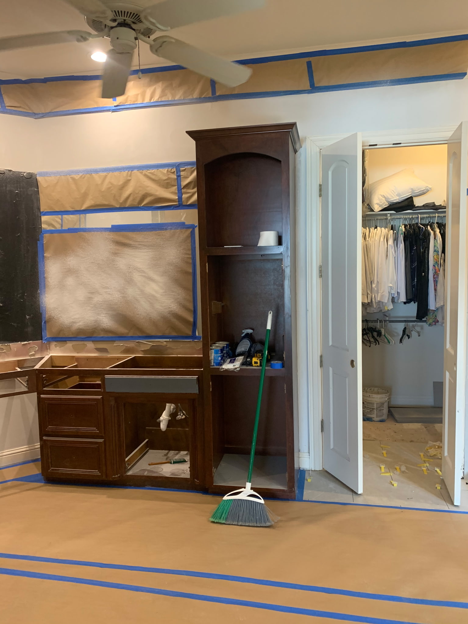 Completed kitchen cabinet painting — dark finish, interior project Shreveport